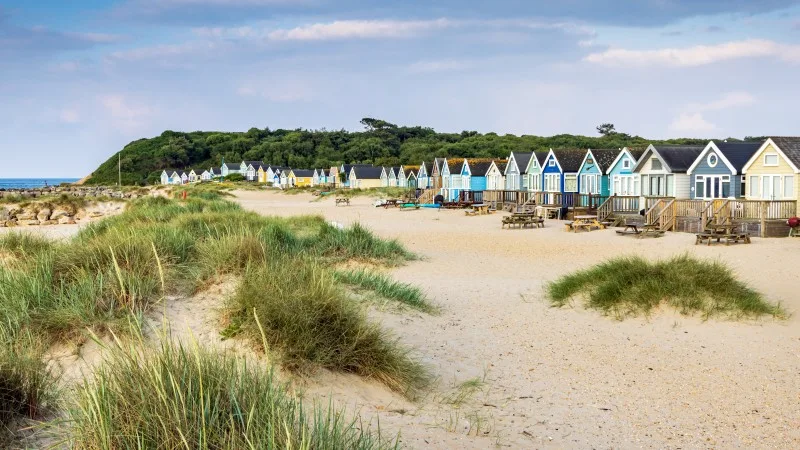 Colourful Beach huts on Mudeford Spit in Dorset, England