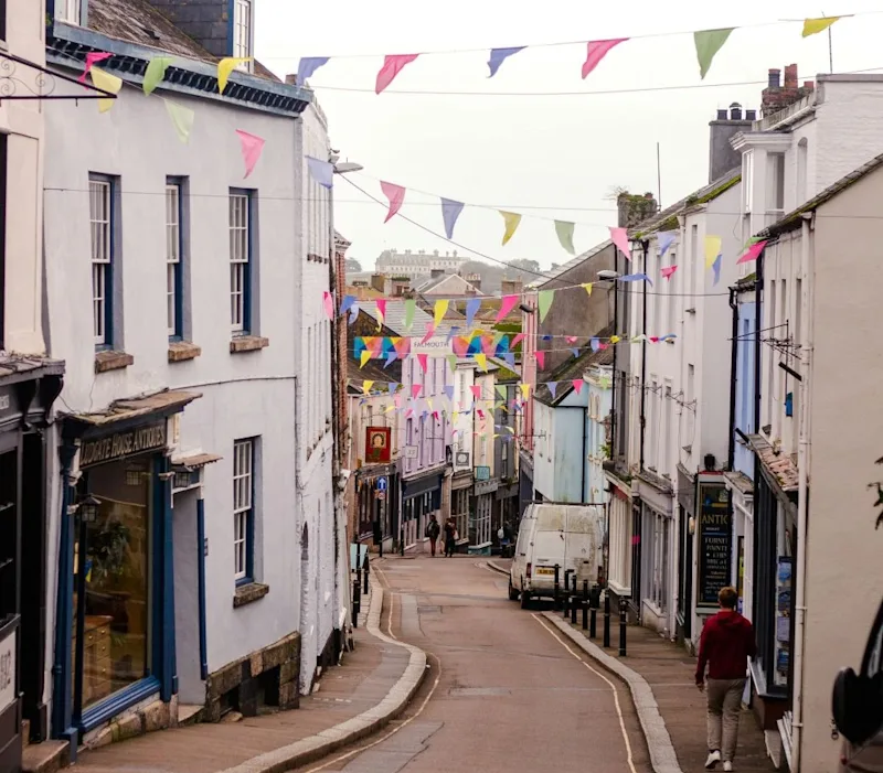 A view of Falmouth high street with colourful bunting in Cornwall, UK