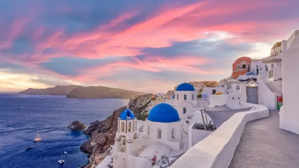 Sunset night view of traditional Greek village Oia on Santorini island in Greece.