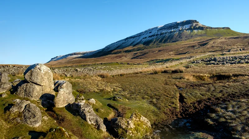 View of a snow-capped Pen-y-ghent in the Yorkshire Dales, England, UK