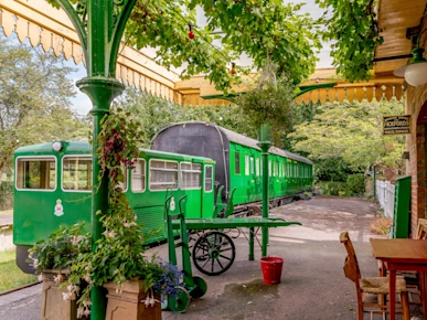 Sprat and Winkle (M555057), a green converted train carriage in Horsebridge, Suffolk, England, UK