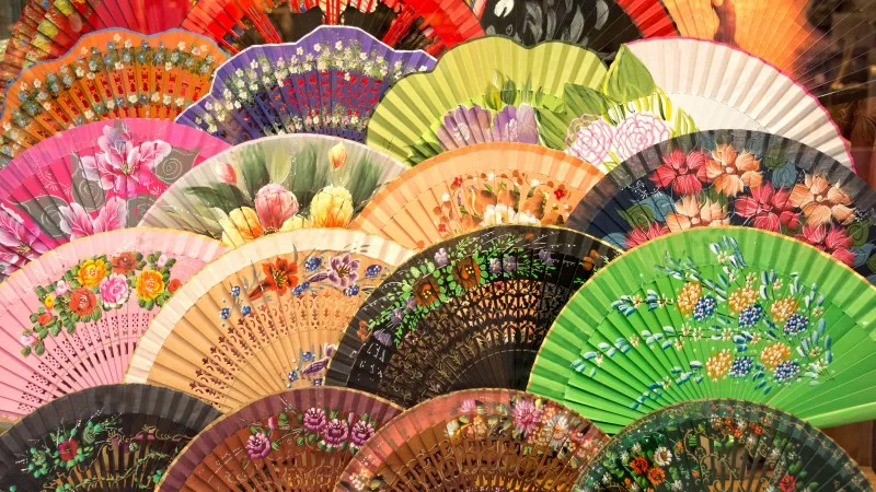 Display of colorful traditional spanish flamenco fans in Andalusia,