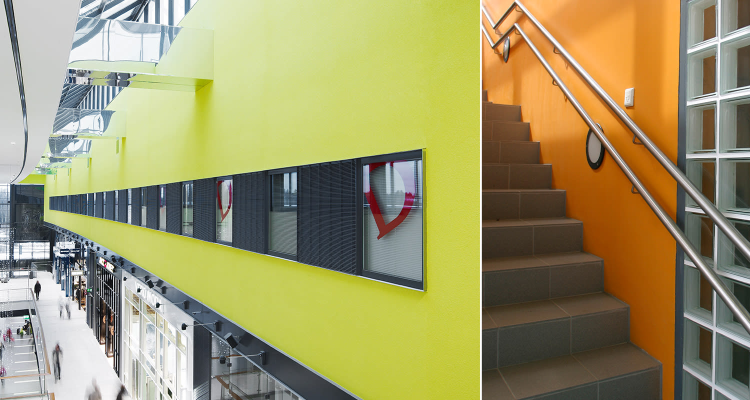 Ammattilaisten Tikkurilan Ässä-maalisarjalla maalattu keltainen julkinen tila ja oranssi rappukäytävä