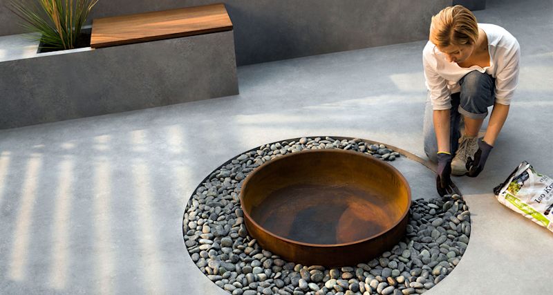 minimalistin-kivipiha-k-rauta-piha-tulisija