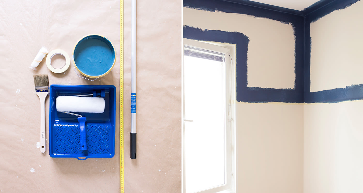 Valkoista huonetta maalataan tummansinisellä, vieressä tela, harja, maalipurkki, mittanauha.