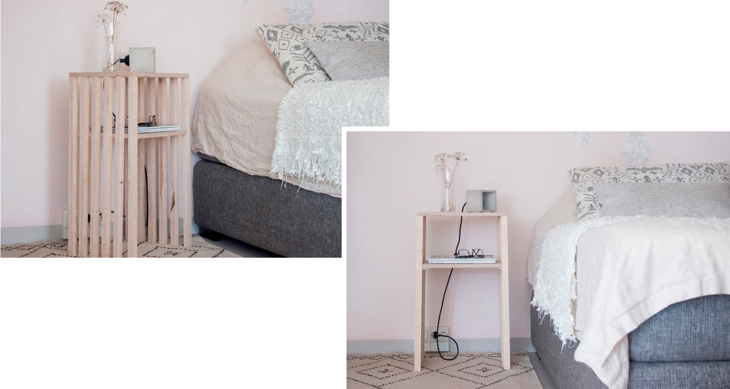 Vaalea puuyöpöytä vaaleanpunaisen seinän edessä, maljakko, lamppu ja harmaa sängynurkkaus.