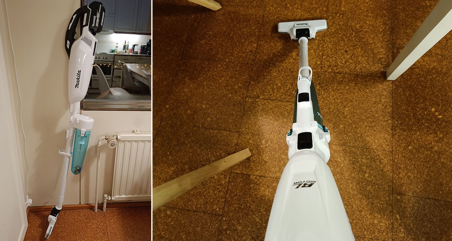 Makitan valkoinen varsi-imuri keittiössä ja keittiön lattian imurointi käynnissä