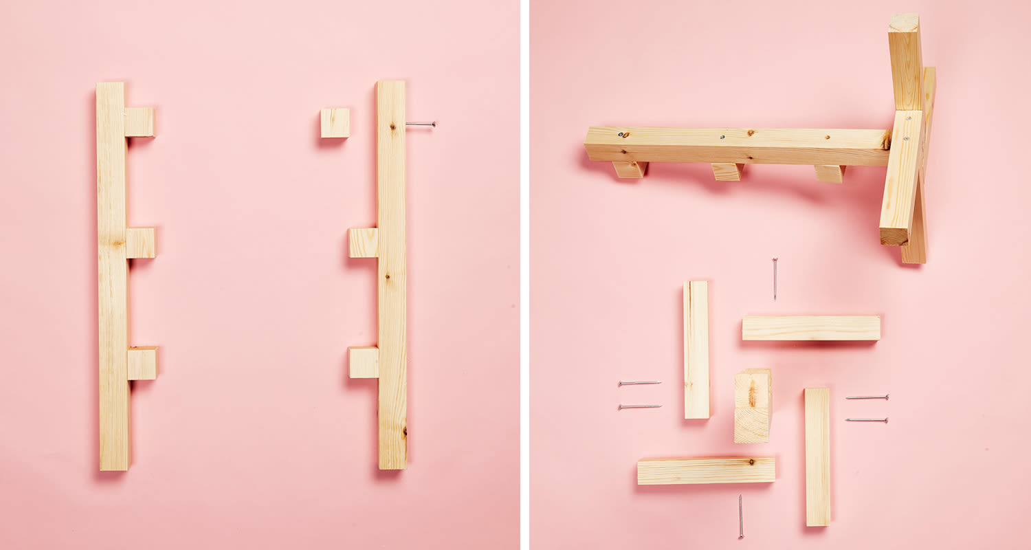 Vaaleat puupalat ja naulat levitelty vaaleanpunaisella taustalla, hyllyosan osia