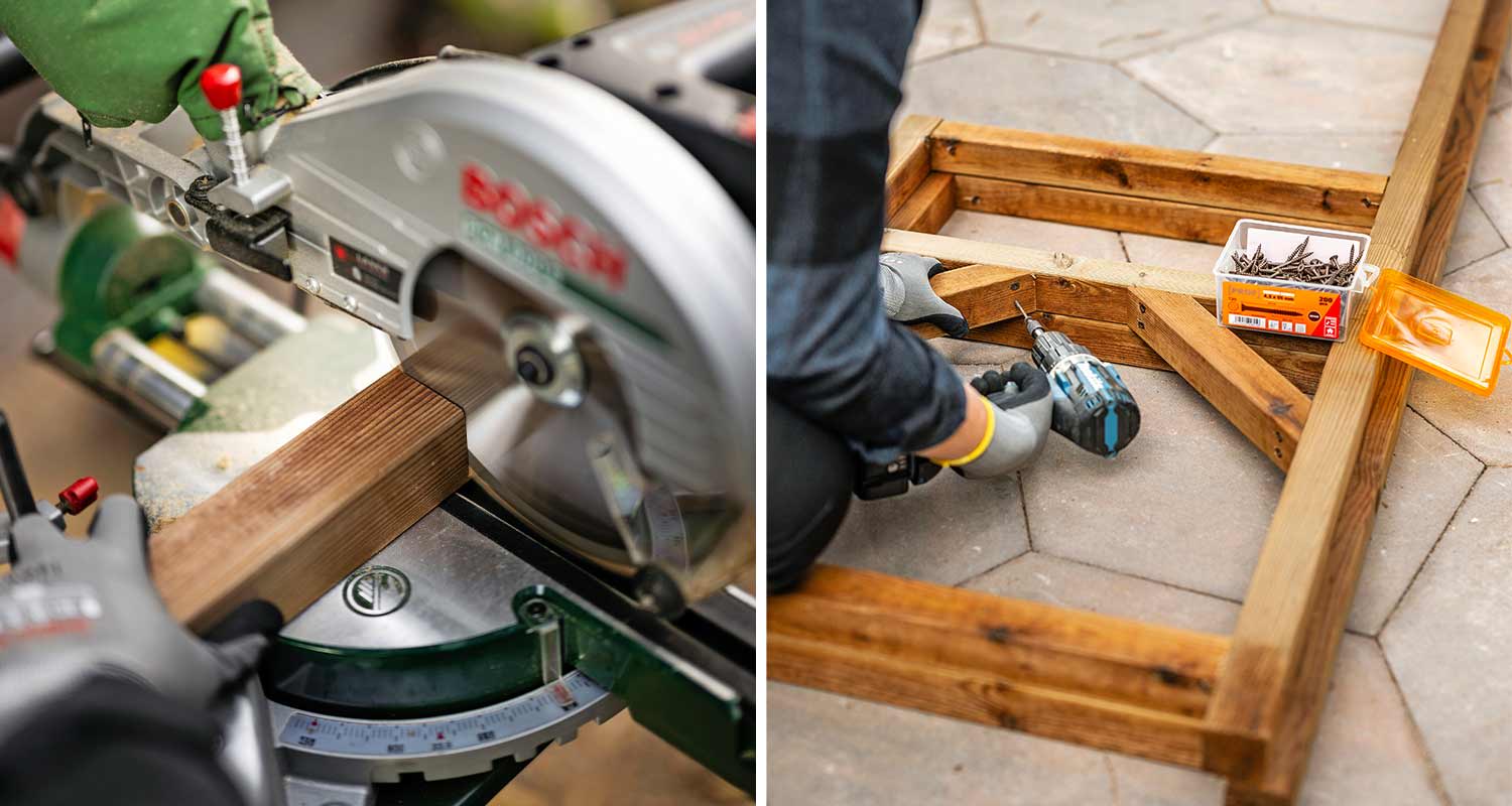 Harmaa jiirisaha leikkaa ruskeaa puutolppaa, vieressä poraava käsityöläinen puukehikolla.