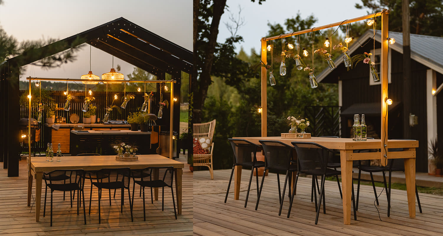 Puutarhapöytä koristetelineellä kesäkeittiön terassilla kesäillan hämärtyessä.