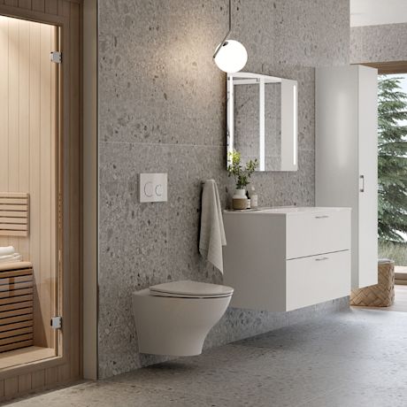 Moderni harmaa terrazzo-kylpyhuone, valkoinen allaskaappi, seinälle kiinnitetty wc ja puusauna
