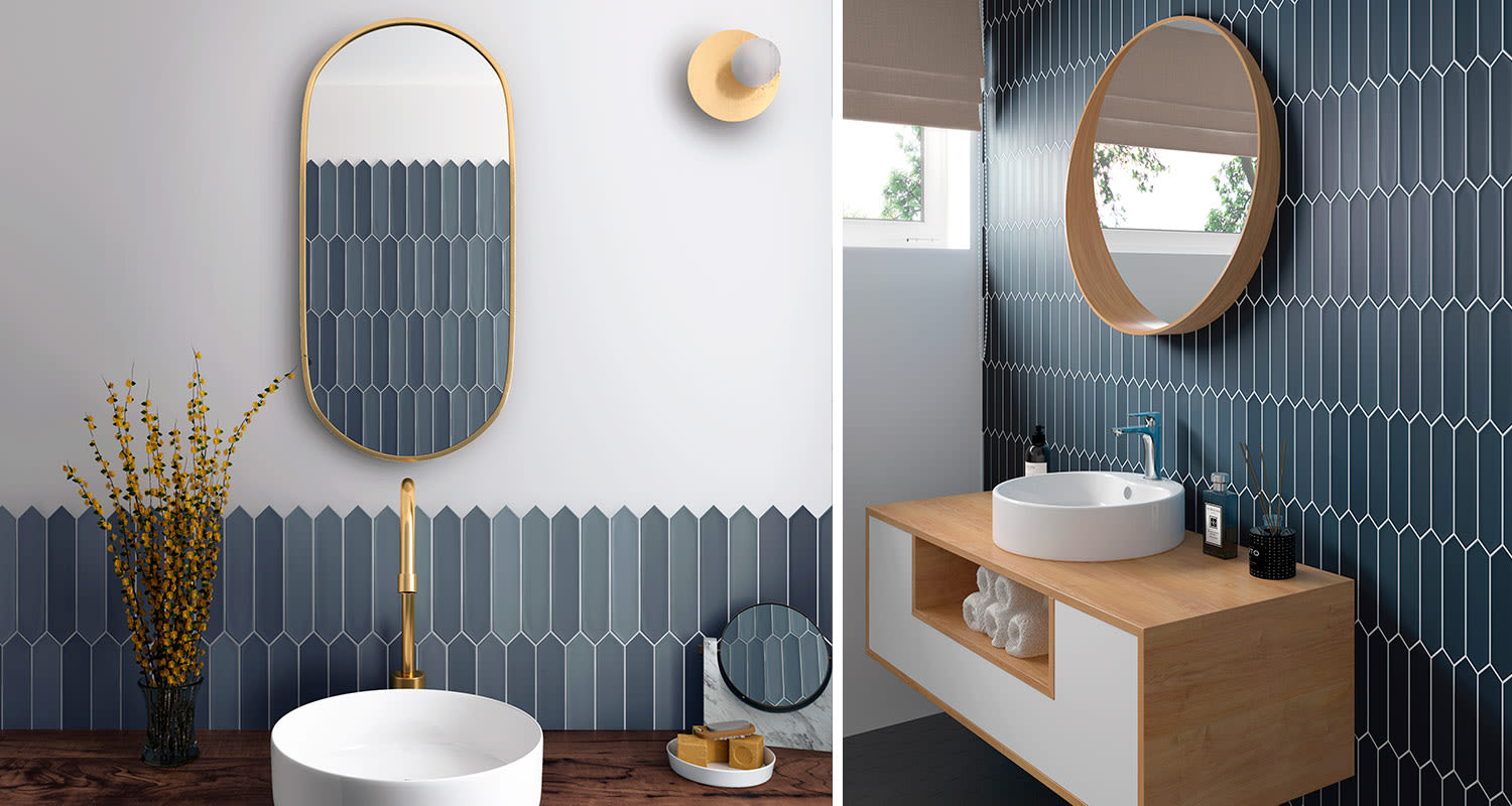 Pitkulainen, geometrinen sininen seinälaatta kylpyhuoneen seinässä puoliksi ja kokonaan laatoitettuna. Laatan nimi: seinälaatta Lanse 5x25 tummansininen matta 502360236, myynnissä K-Raudassa