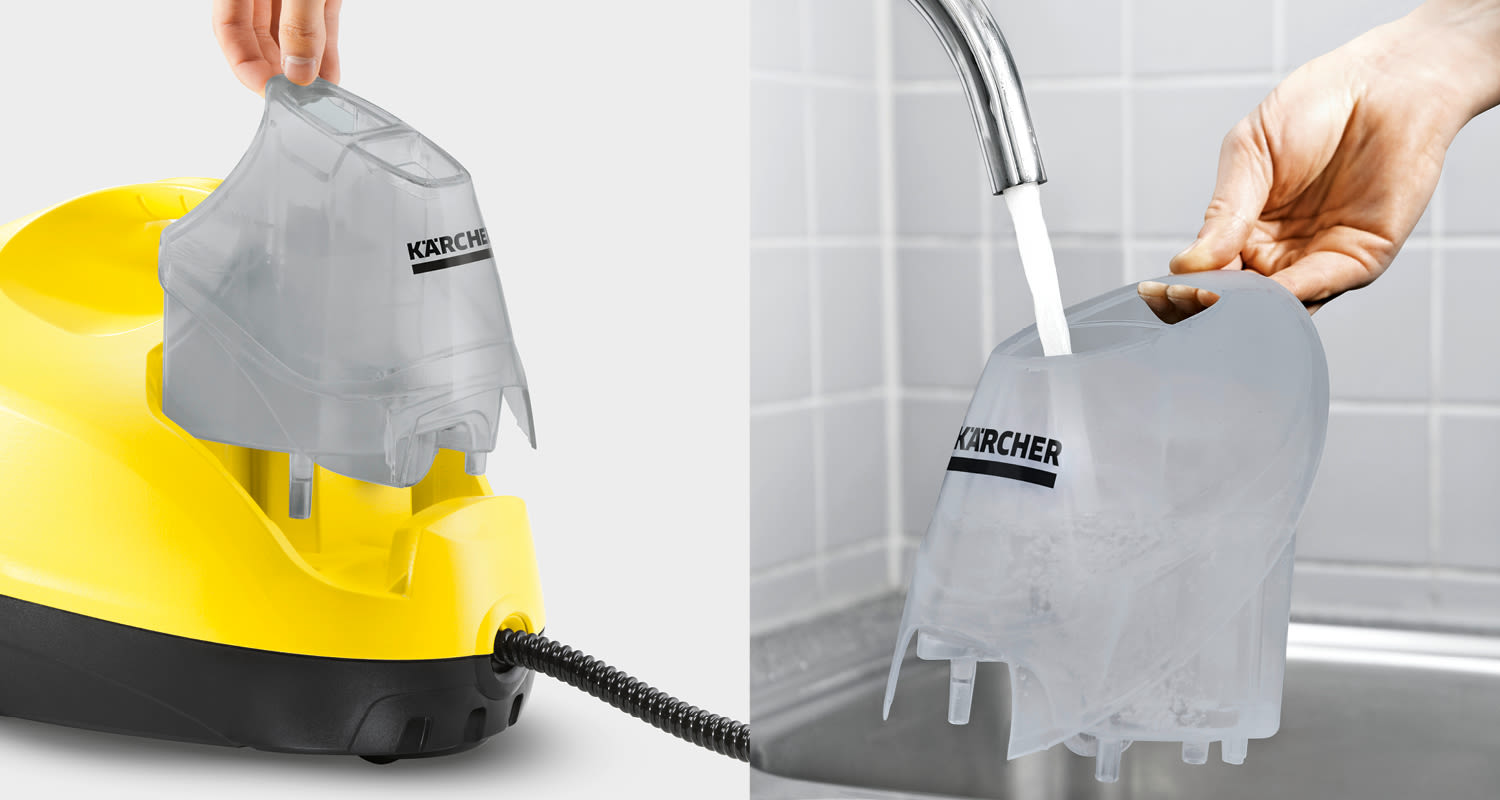 Keltainen Kärcher-höyrypuhdistin, harmaa läpinäkyvä vesisäiliö irrotettuna ja hanassa täyttymässä.