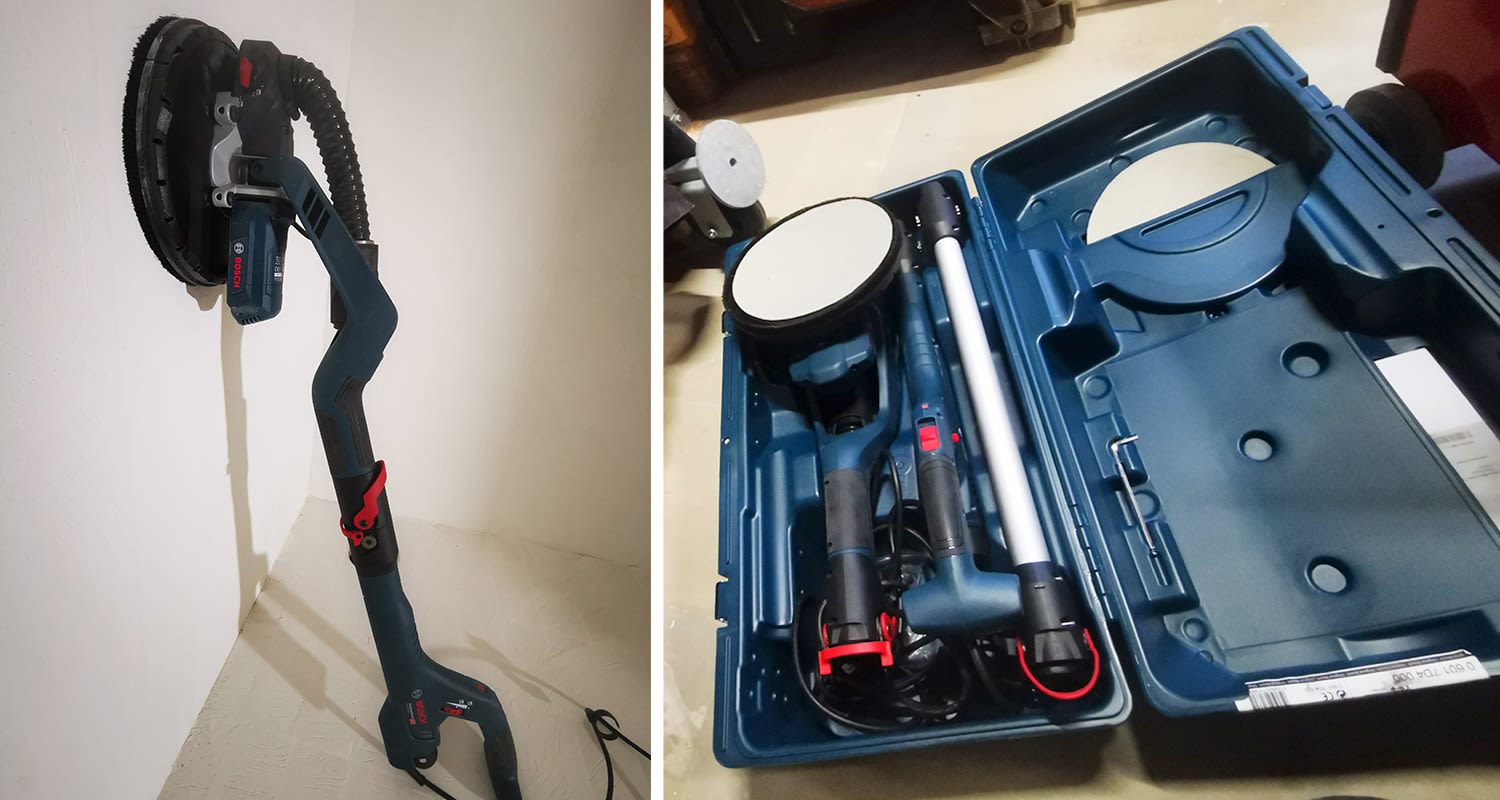 Ammattilaisella testissä varsihiomakone Bosch, salkku avattuna ja kone seinää vasten