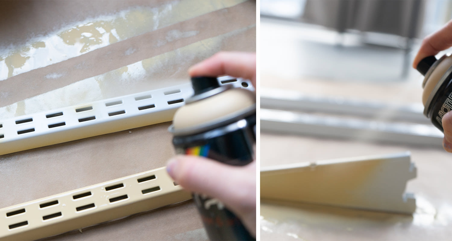 Käsi suihkuttaa spraymaalia vaalealle metallikiskolle ruskean suojapaperin päällä