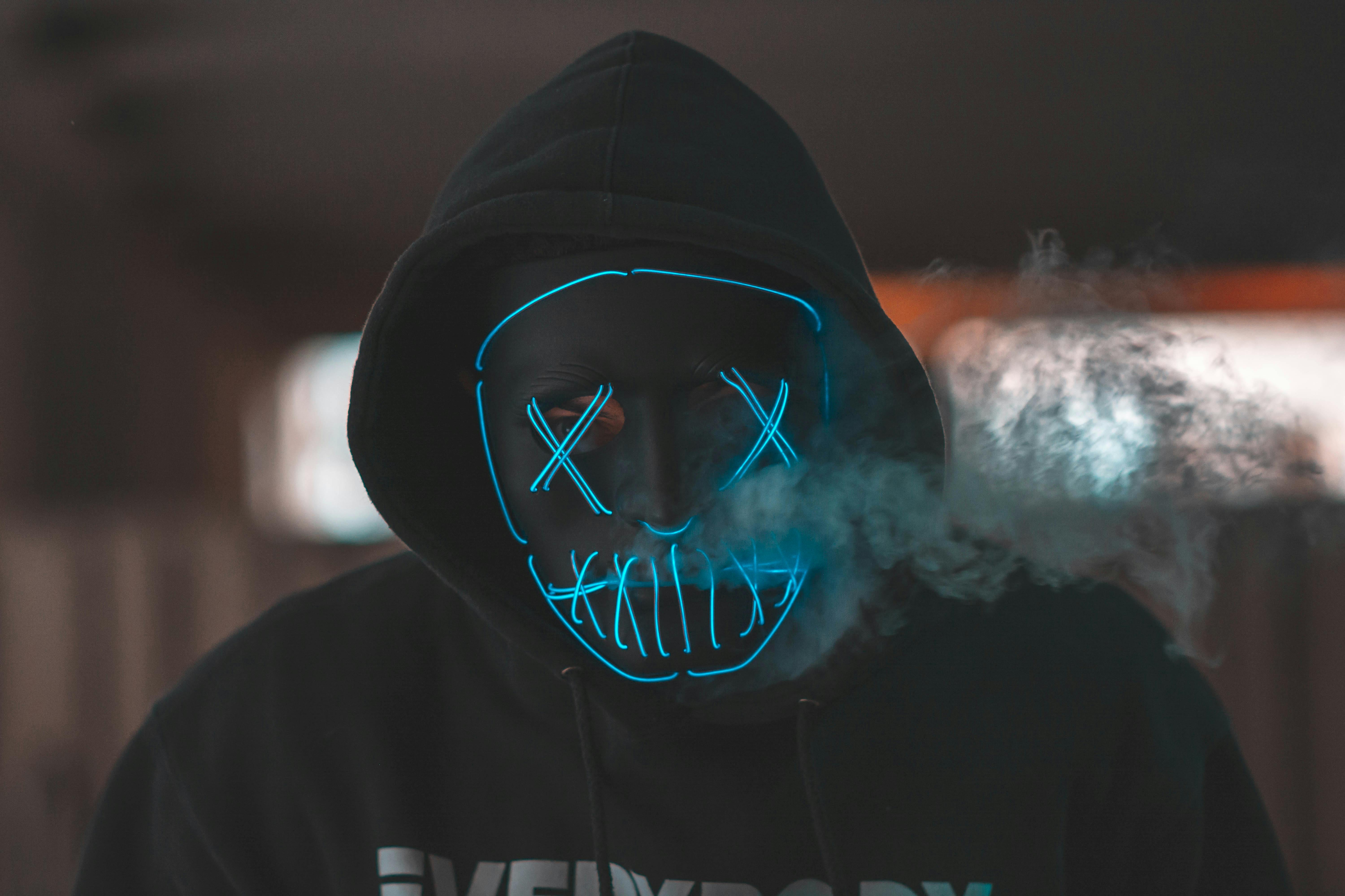 Free Man Wearing Black Mask And Hoodie Jacket Stock Photo
