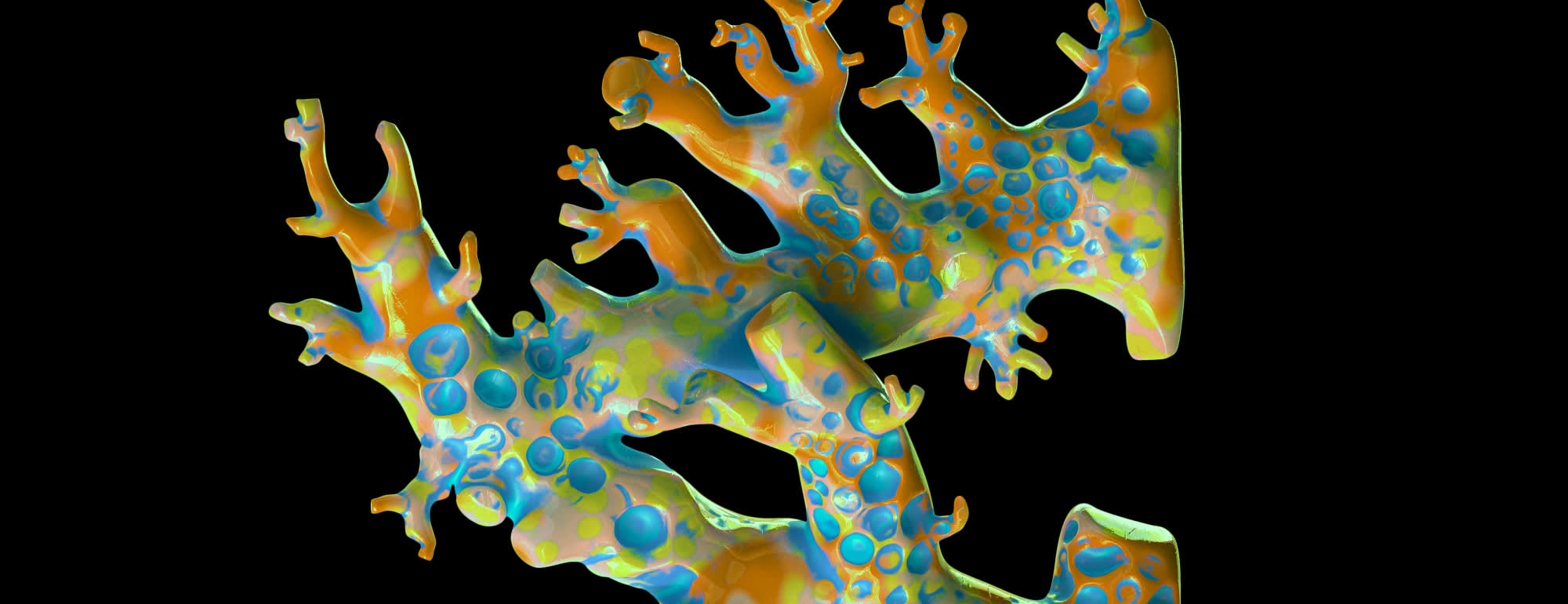 A single piece of brightly-coloured coral, with splashes of pale yellow, orange, and blue.