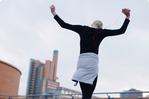 A lady celebrating her success after a run.