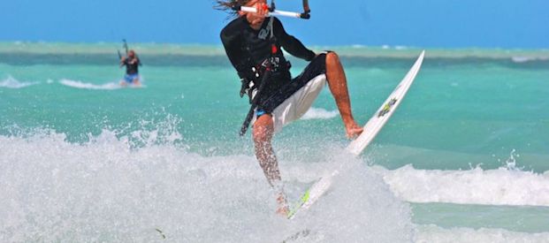 Kiteboarder doing jumps.
