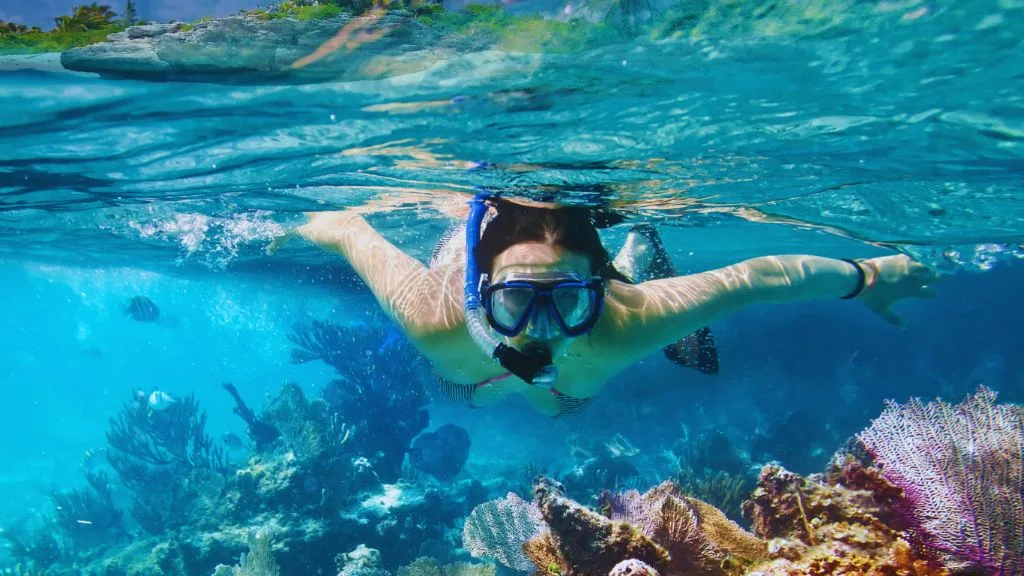 woman-snorkeling-reef-Bahamas