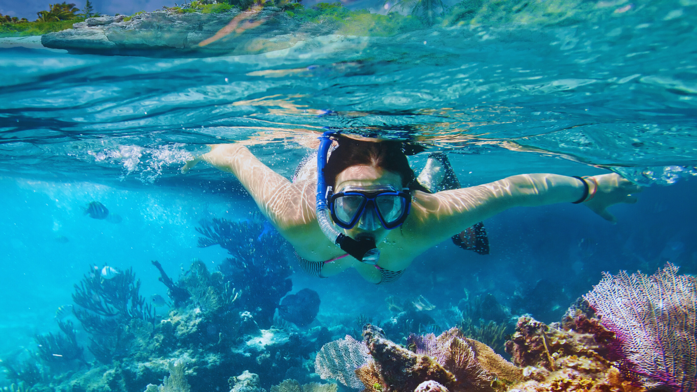 woman-snorkeling-reef-Bahamas