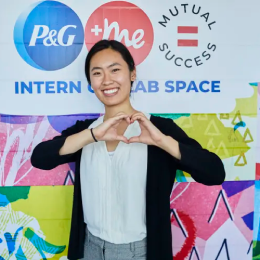 Intern making a heart shape with palms