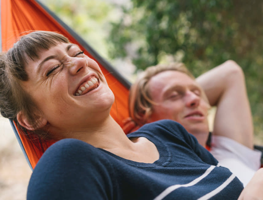 A couple having a good time in a hammock