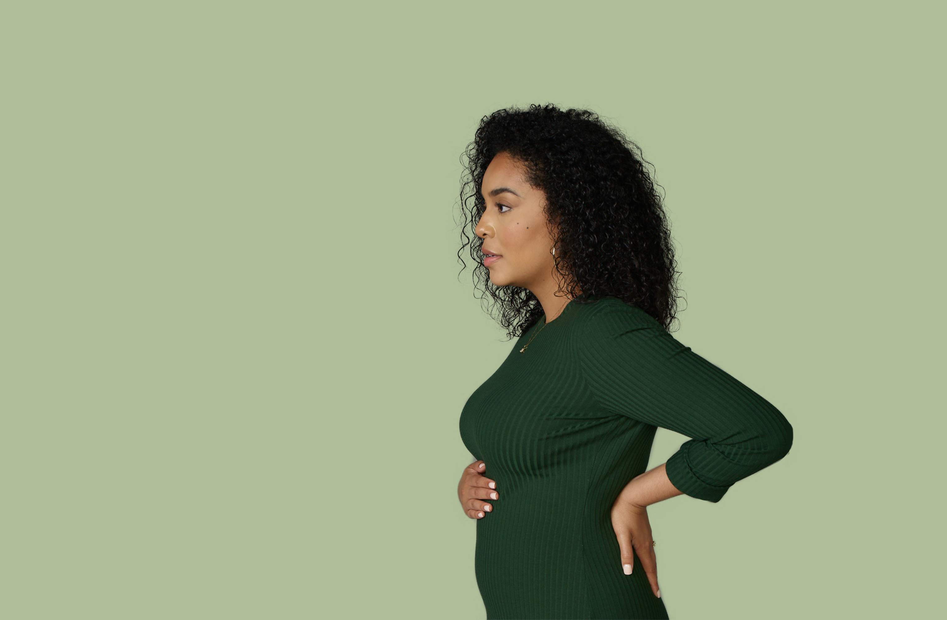 Pregnant woman with green background