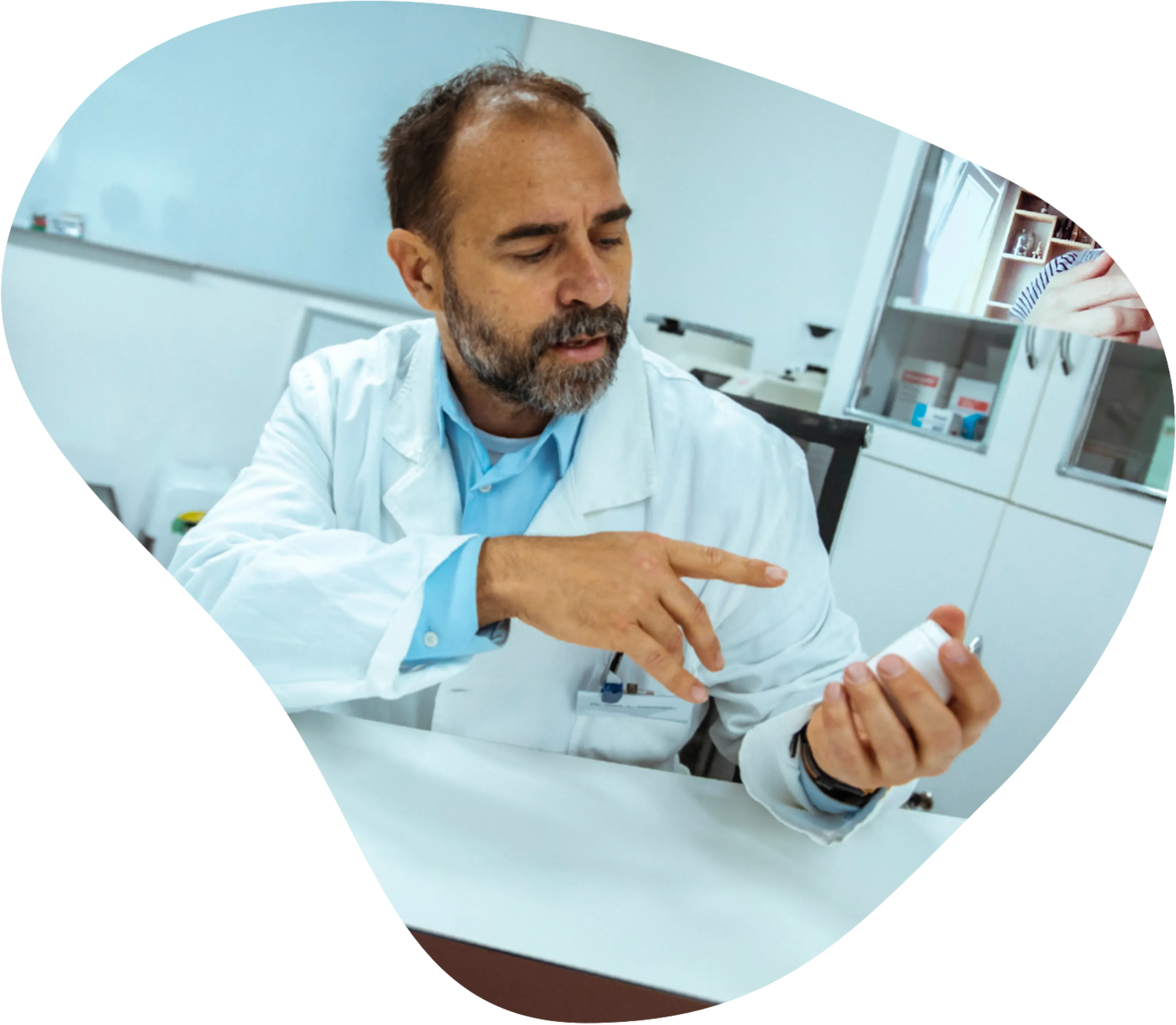 Male medical specialist holding object