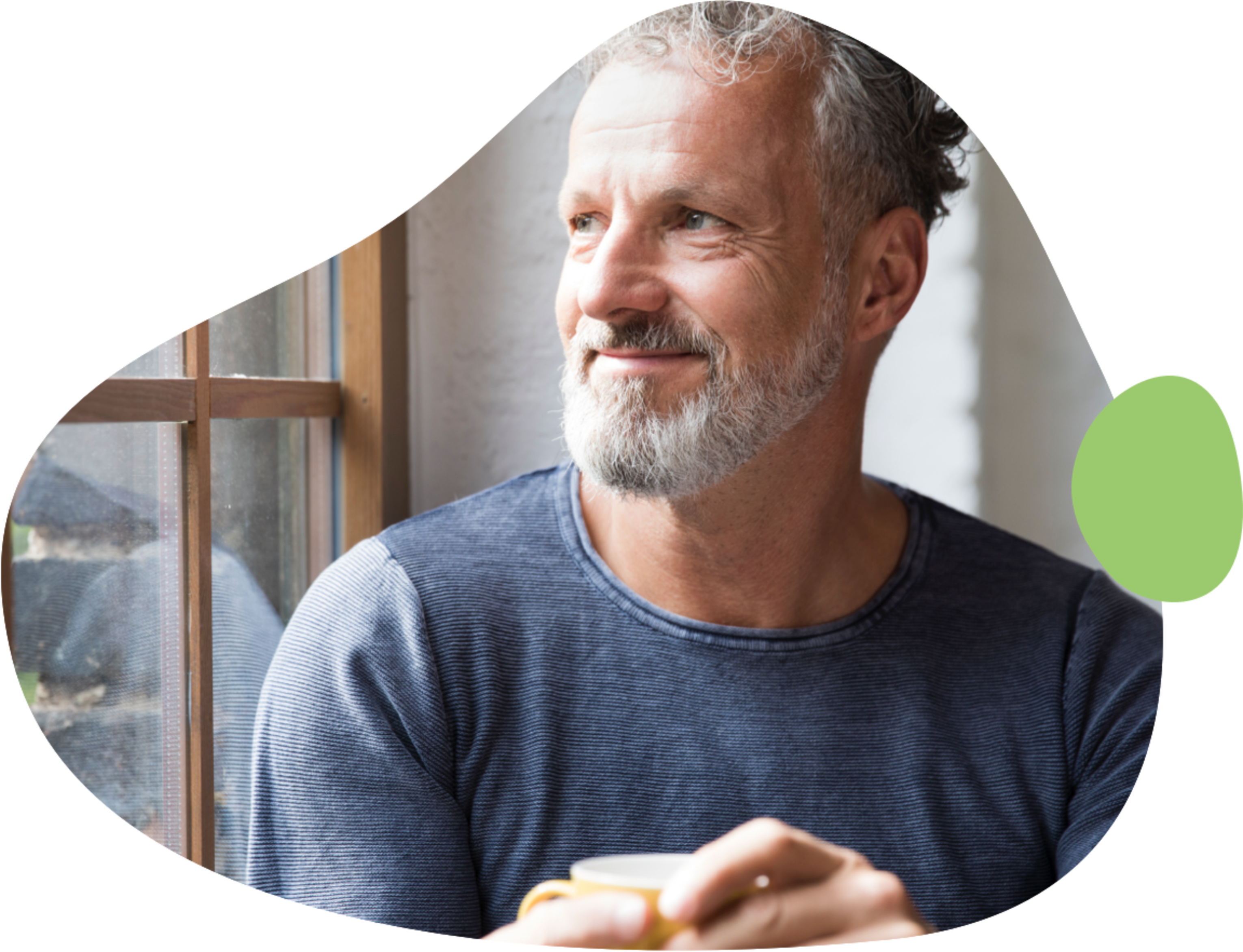 Gray-haired male in blue shirt looking out window