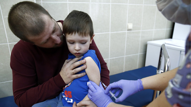 Boy getting MMR vaccination