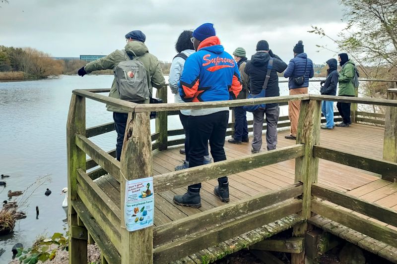 Some people on the lookout spot at the Welsh Harp