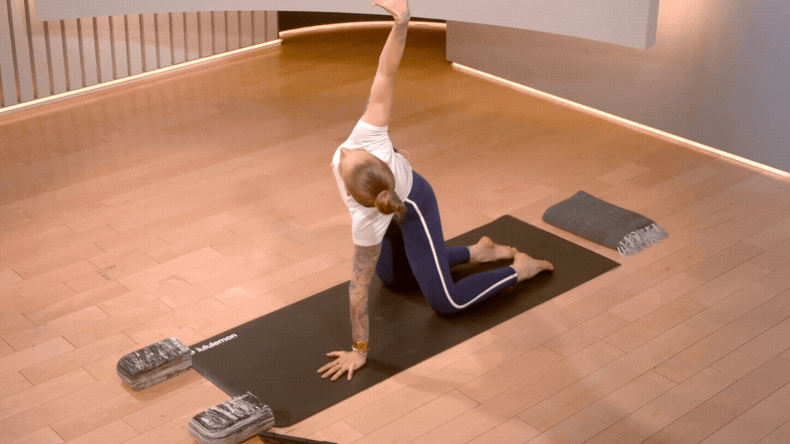 Peloton instructor Kirra Michel demonstrates thread the needle spinal mobility exercise.