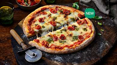 Large pizza and a pizza cutter.