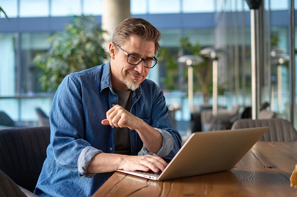 A veteran entrepreneur working on his laptop