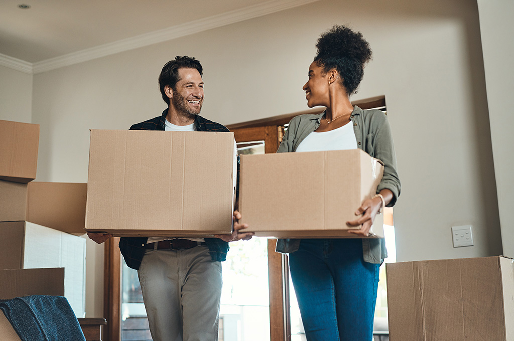 A veteran couple moving after finding out about veteran housing assistance