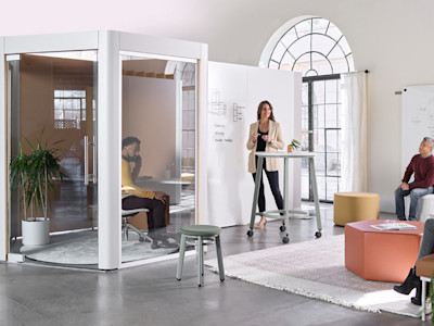 movable office furniture with employee phone booths and mobile partitions in a modern office