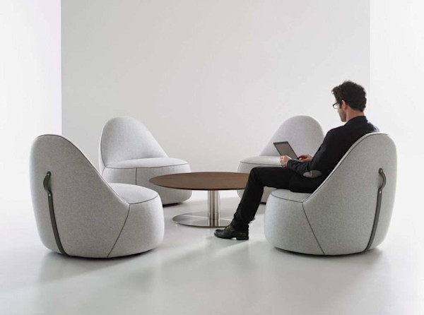 collaborative lounge area and comfortable hybrid workspace for modern office design