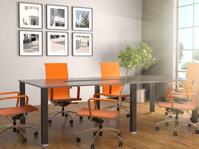 Office conference table with orange chairs