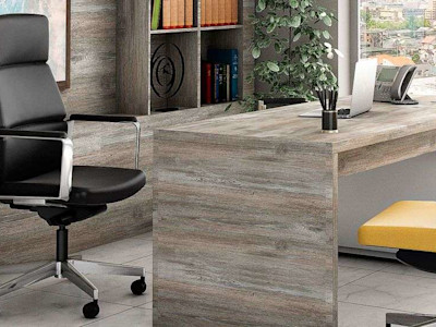 executive ergonomic chairs at desk in large office