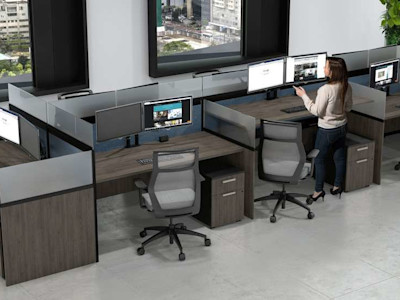 2 women in modern cubicle with greenery