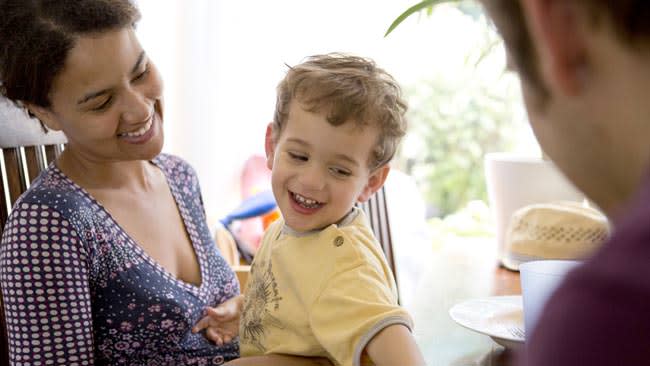Mother and son, smiling.