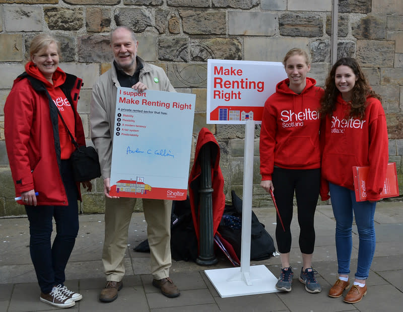 Man signing Shelter Scotland campaign petition