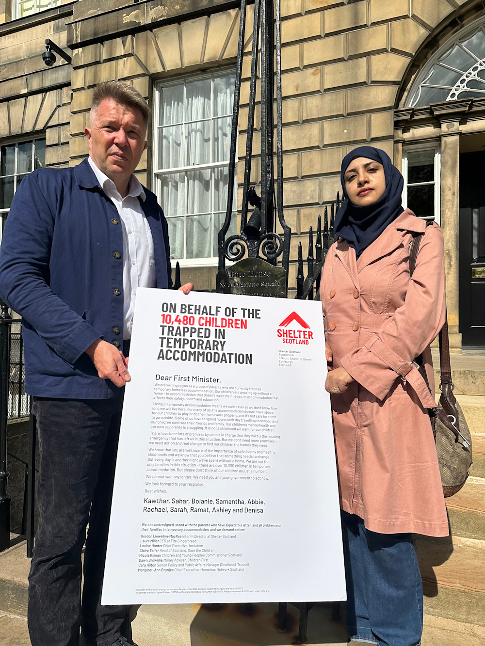 Shelter Scotland Director Gordon Llewellyn-MacRae and Sarah outside Bute House delivering the letter to the First Minister's front door