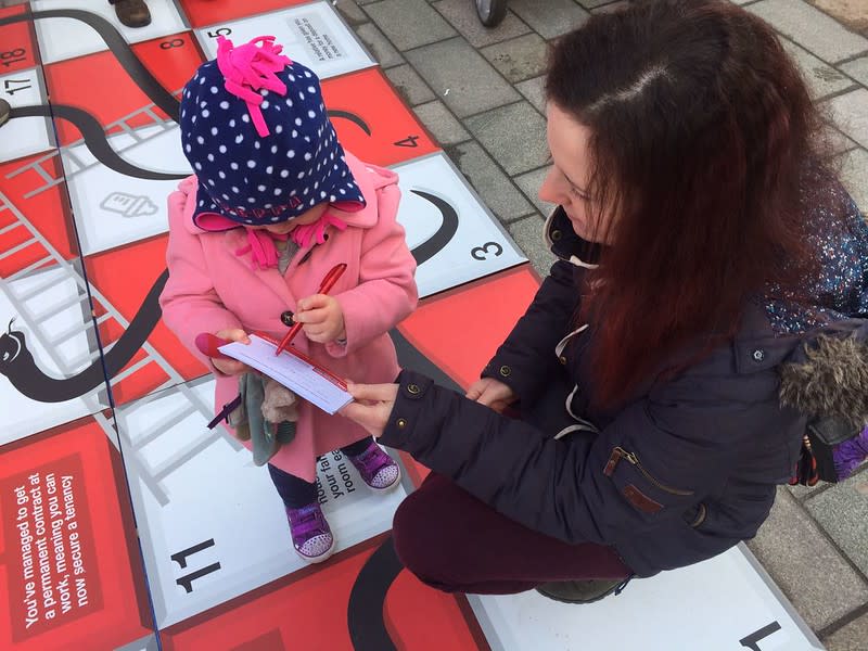 Small girl signing petition