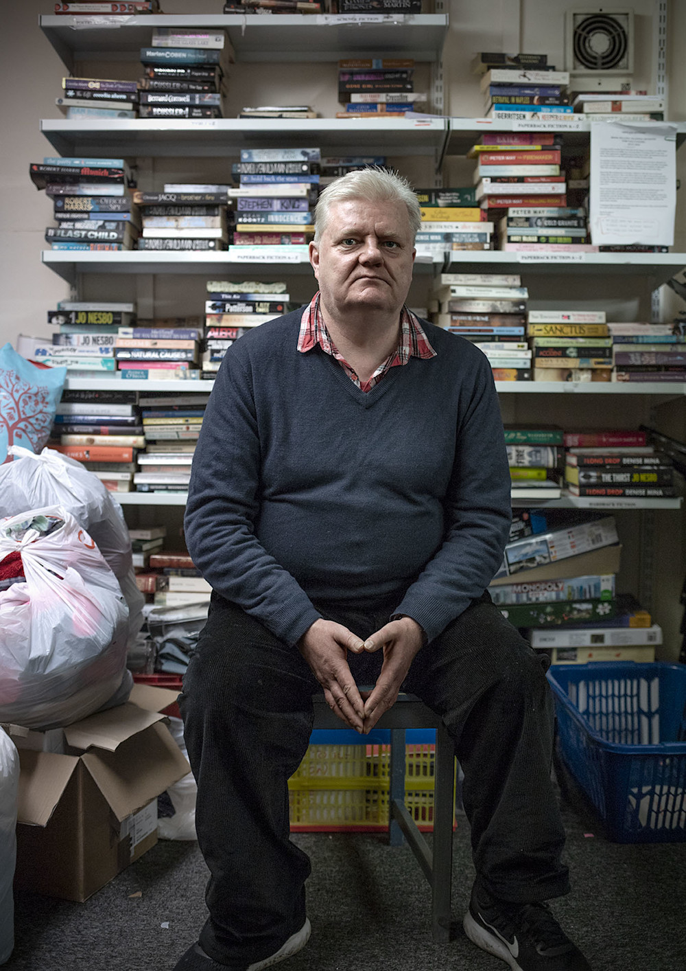 Gerry, a volunteer at a Shelter Scotland shop. Photographed for Shelter Scotland's 50th anniversary by Melissa Mitchell.