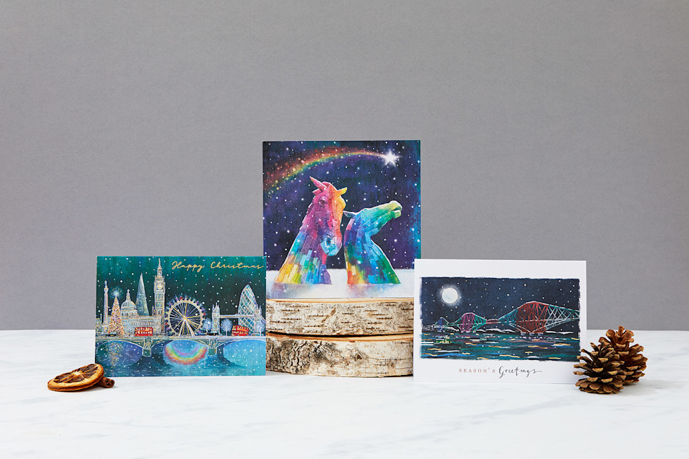 London Pride, Rainbow Kelpies and Rainbow cards arranged with natural winter decorations.