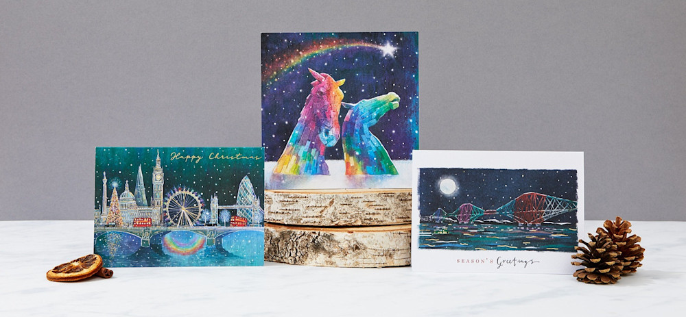 London Pride, Rainbow Kelpies and Rainbow cards arranged with natural winter decorations.