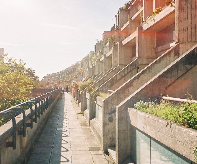 An outdoor scene of sunlit social housing