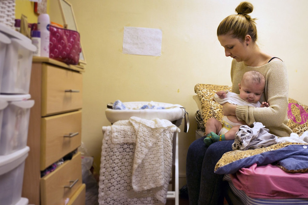 Mother and baby in overcrowded room